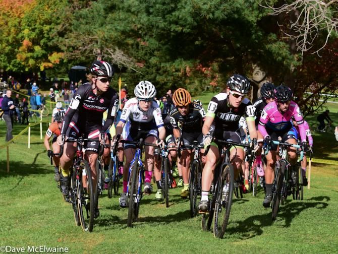 Gabby Durrin (Neon Velo) takes the hole-shot on the uphill grassy start