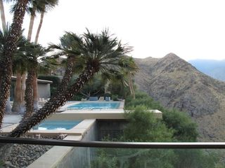 View of swimming pools with mountainous background