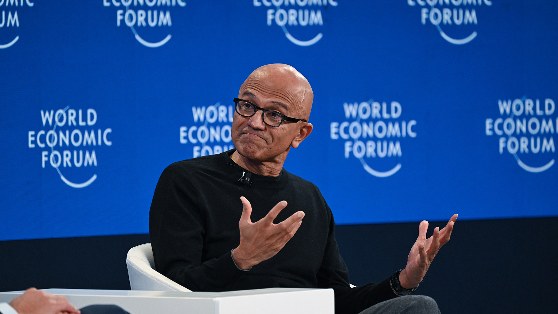 A telephoto shot of Satya Nadella, CEO at Microsoft, speaking at the 2026 World Economic Forum in Davos.