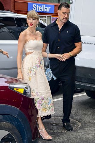 Taylor Swift and Travis Kelce walk into Electric Lady Studios in New York City where Taylor wears a cut-out Zimmermann dress