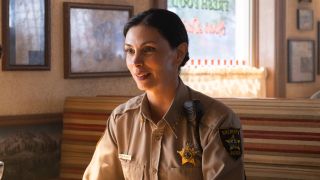 Morena Baccarin as Mickey sitting in a booth at a resturant in Sheriff Country.