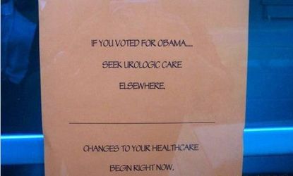 The taped-up sign encourages Obama supports to seek care elsewhere.