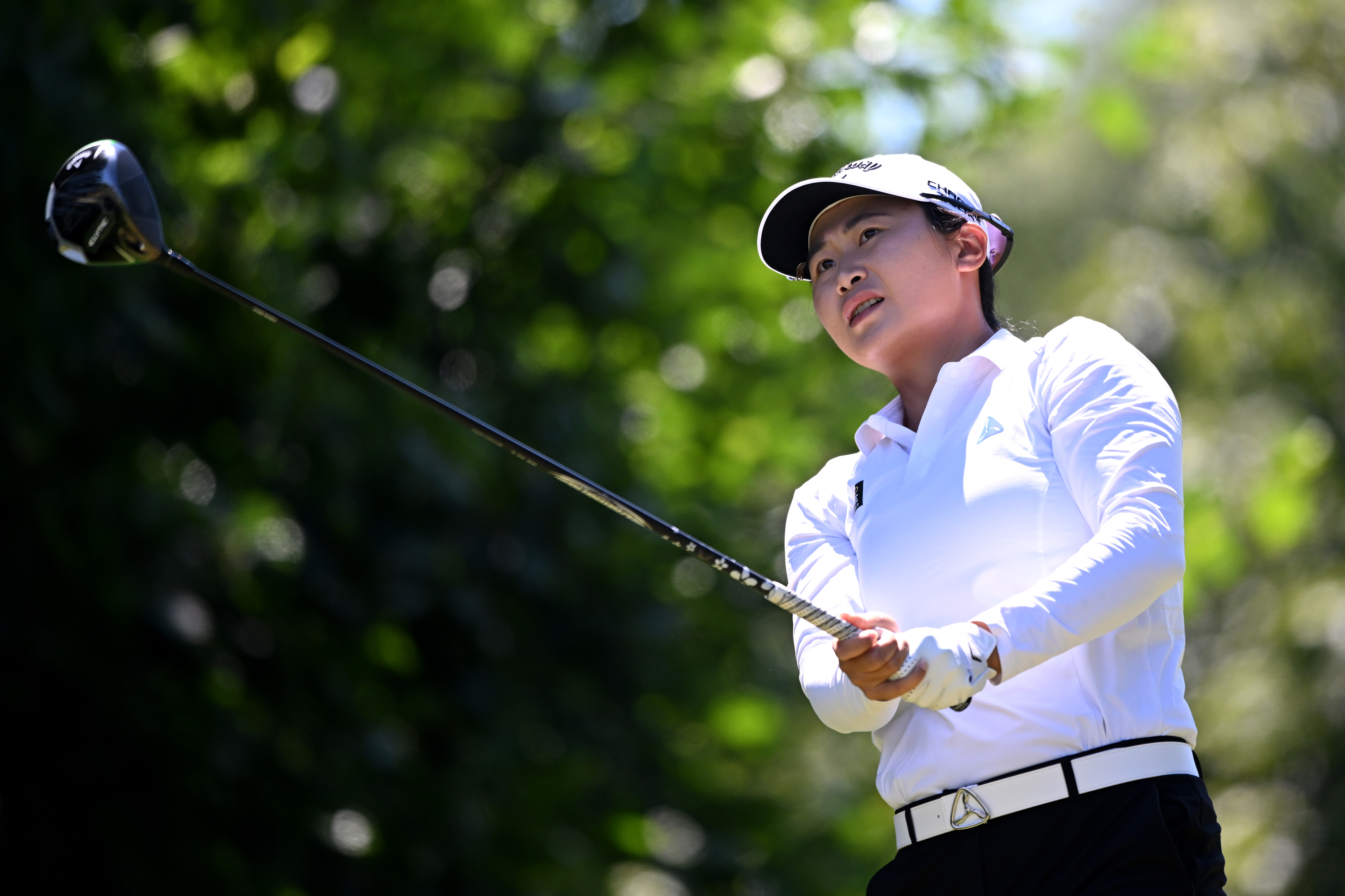 Yan Liu hits a driver off the tee
