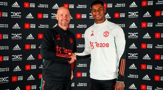 Marcus Rashford of Manchester United poses with Manager Erik ten Hag after signing a new contract extension at Carrington Training Ground on July 18, 2023 in Manchester, England. (Photo by Manchester United/Manchester United via Getty Images)