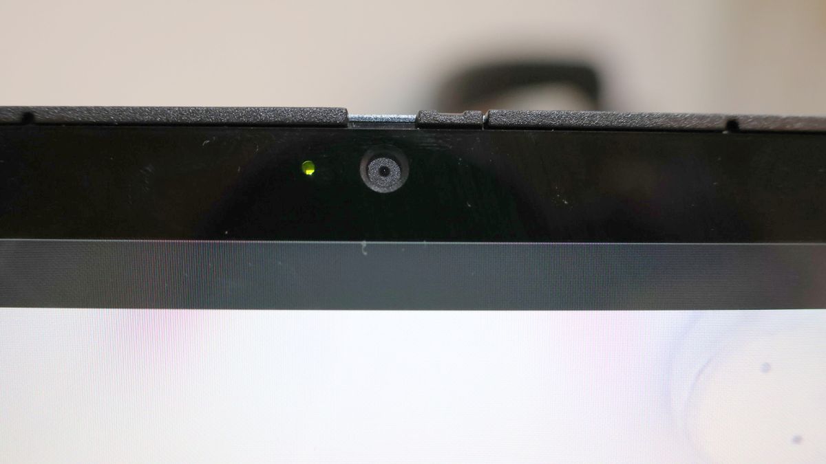 Close up of the Acer Chromebook Spin 714's webcam against a pink background.