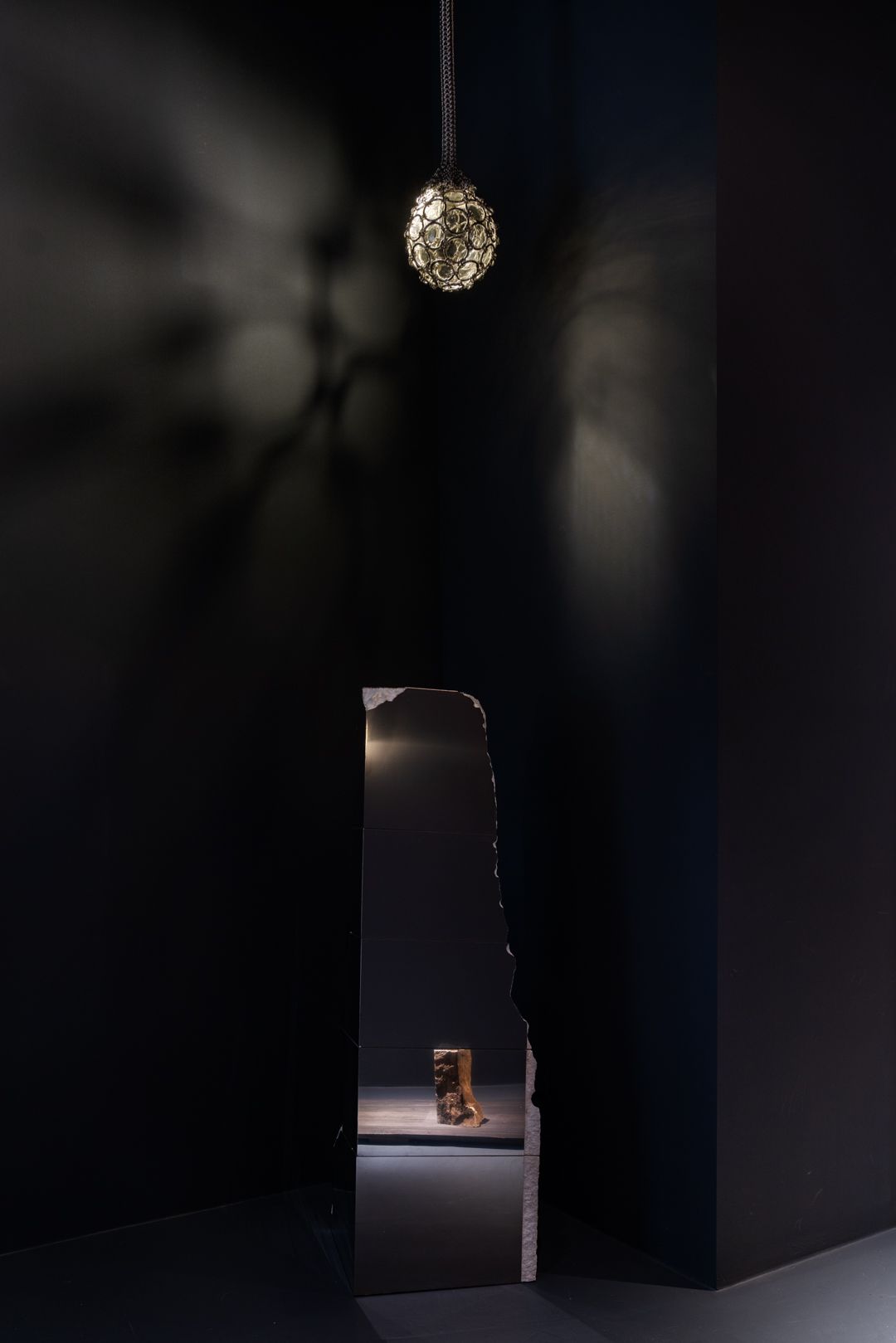 artwork displayed in black gallery space