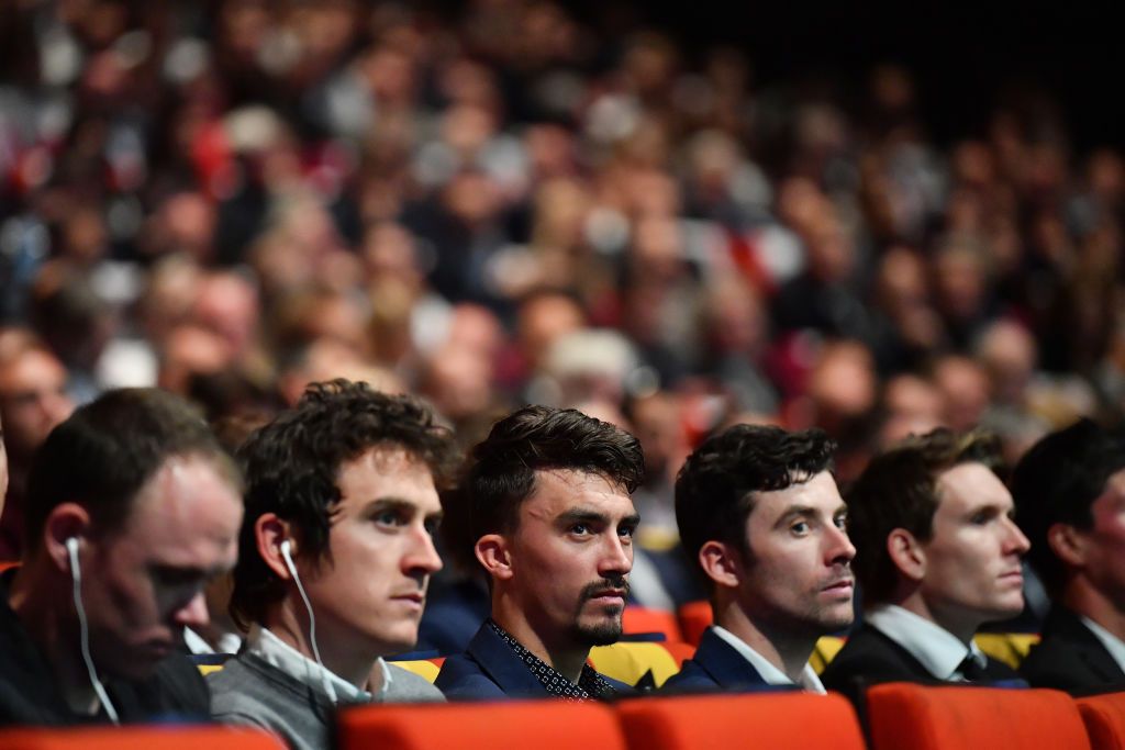 Riders watch on at the 2019 Tour de France presentation in Paris