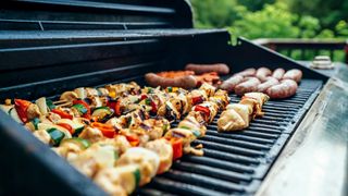Grill with kabobs and other grilled food