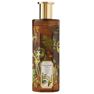 A bottle of Apothecary 18 Woody Sandalwood Vanilla Room Spray from Anthropologie