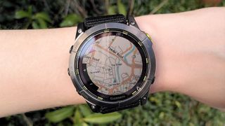 Woman's wrist wearing Garmin Enduro 2 watch