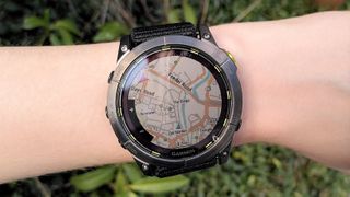 Woman&#039;s wrist wearing Garmin Enduro 2 watch