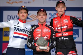 Winner Eli Iserbyt (centre) and Pauwels Sauzen-Bingoal teammate Michael Vanthourenhout (right) share the podium with British champion Tom Pidcock after the 2019 Koppenbergcross