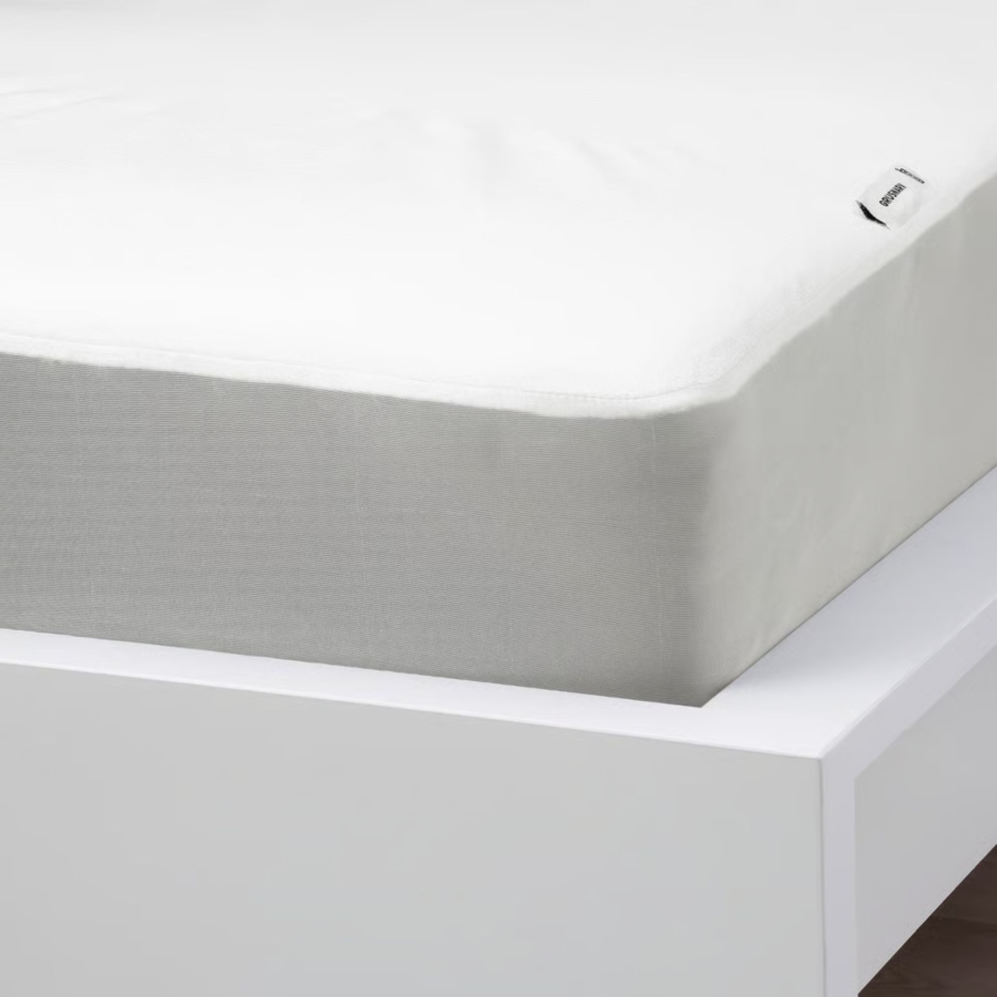 White IKEA GRUSNARV mattress protector