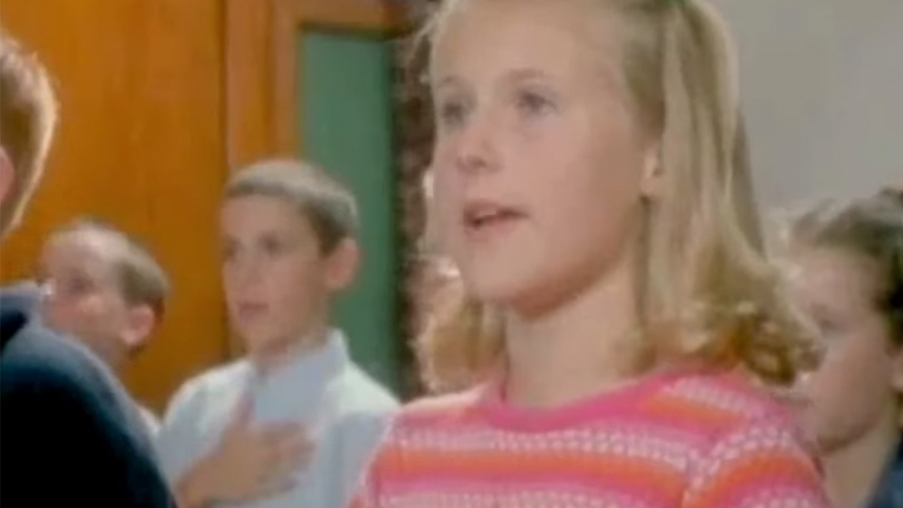 A young girl saying the pledge of allegiance in C.S.A.: The Confederate States of America