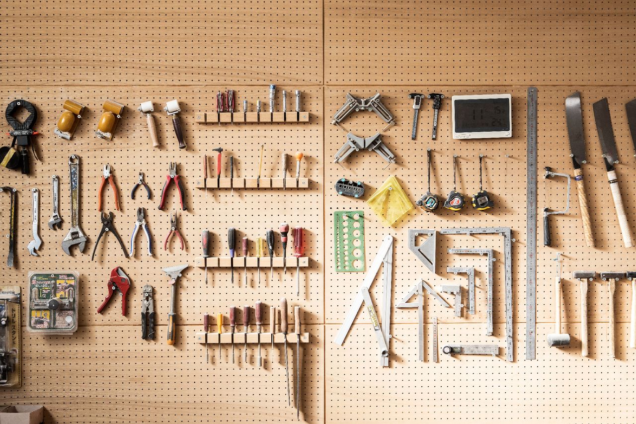 Various DIY tools arranged on the wall 