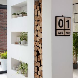 log storage ideas dividing wall