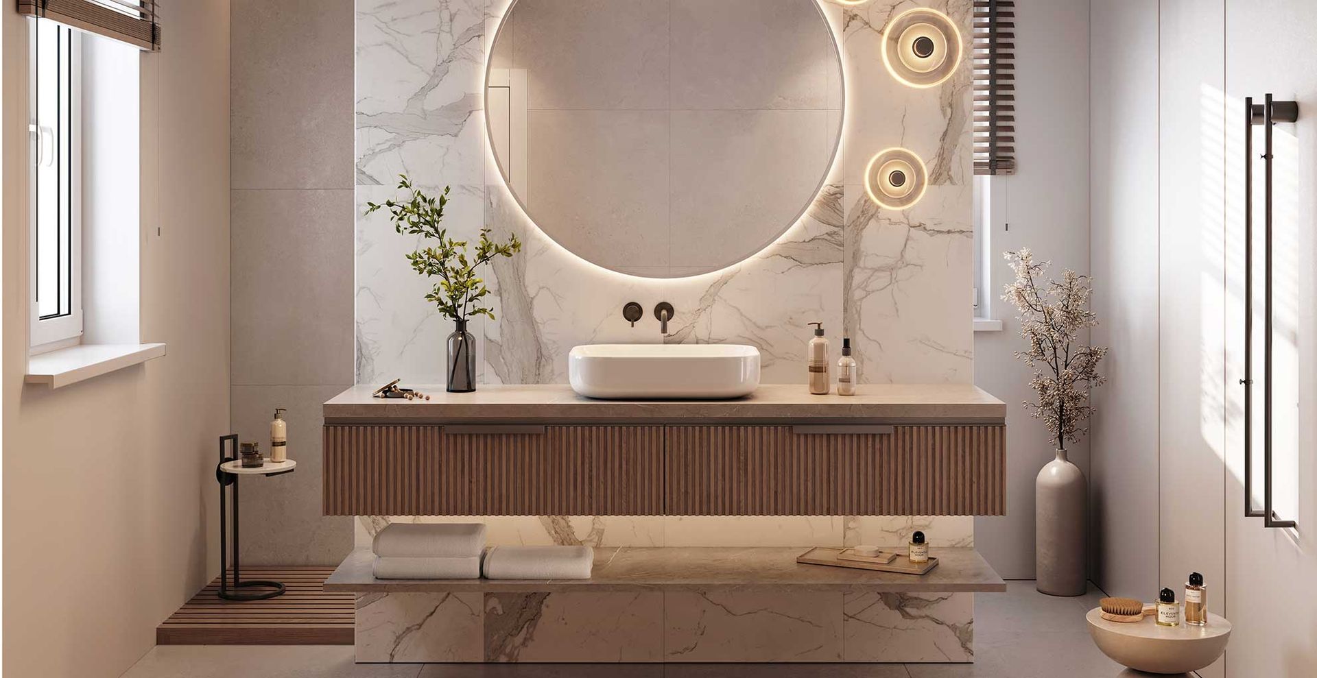 quiet luxury bathroom with lights around the mirror and lights under the cabinets to show attention to detail