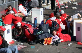 People take cover during a shooting at Union Station during the Kansas City Chiefs Super Bowl LVIII victory parade on February 14, 2024.