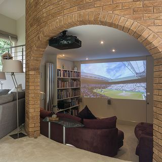 living room with sofa and bookshelves