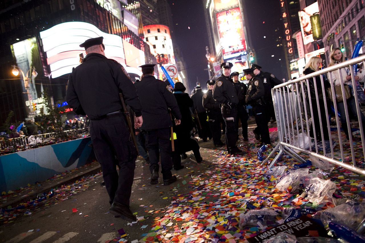 NYPD officers walk through Times Square.