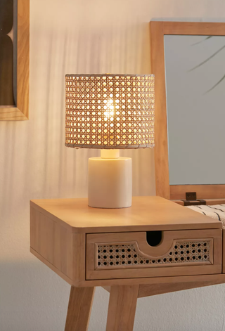 rattan table lamp on a rattan chest of drawers