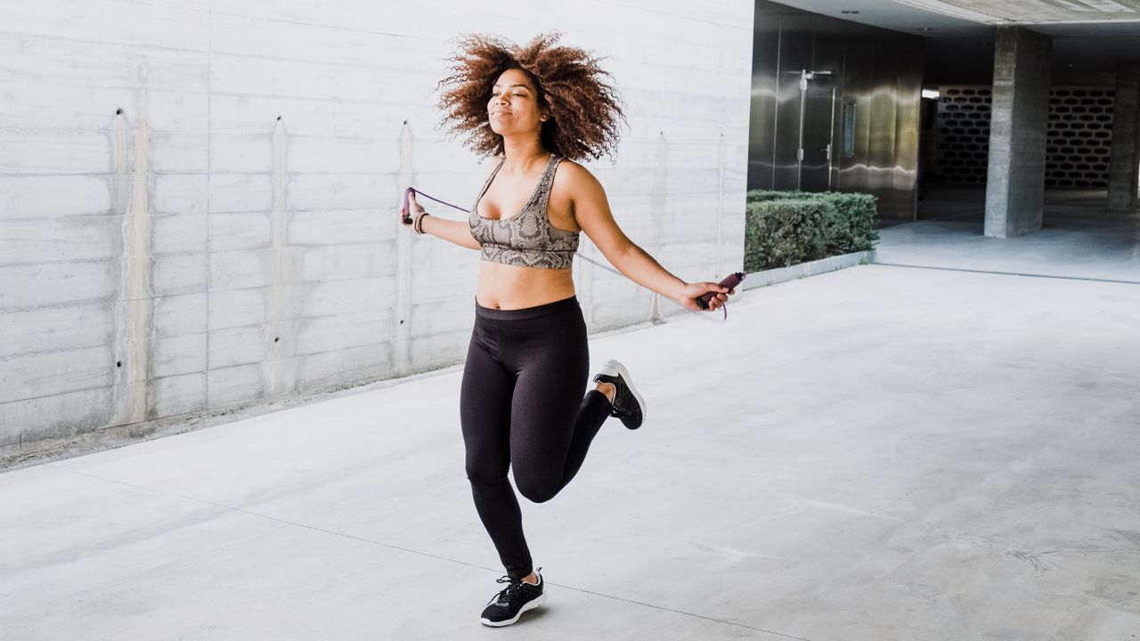 woman jumping rope outside