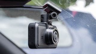 Miofive S1 dash cam attached to a car windscreen