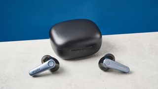 EarFun Air Pro 3 wireless earbuds sitting next to their case