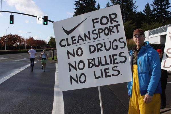 Former professional cyclist Todd Littlehales protests Nike's support of Lance Armstrong in front of the Nike World Headquarters campus in Beaverton, Oregon, on Oct. 16, 2012