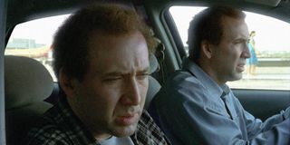 Charlie Kaufman (Nicolas Cage) drives a car with his twin brother Donald Kaufman (Nicolas Cage) sitting in the passenger seat in 'Adaptation'