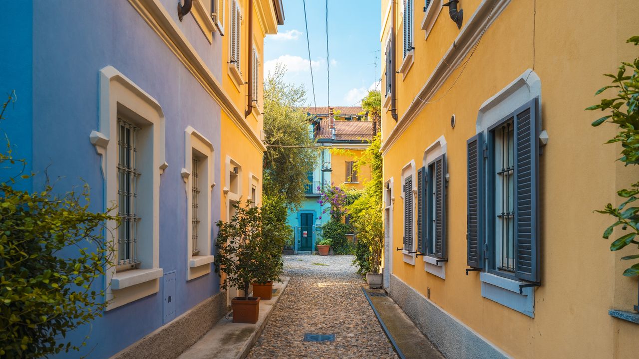 A walkway between two homes in Milan.