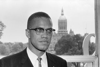 Malcolm X pictured in front of the state capitol Hartford, Connecticut, June 4, 1963 