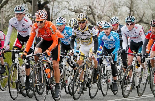 The peloton climbing the last hill before the downhill ride to the north coastline of the island.