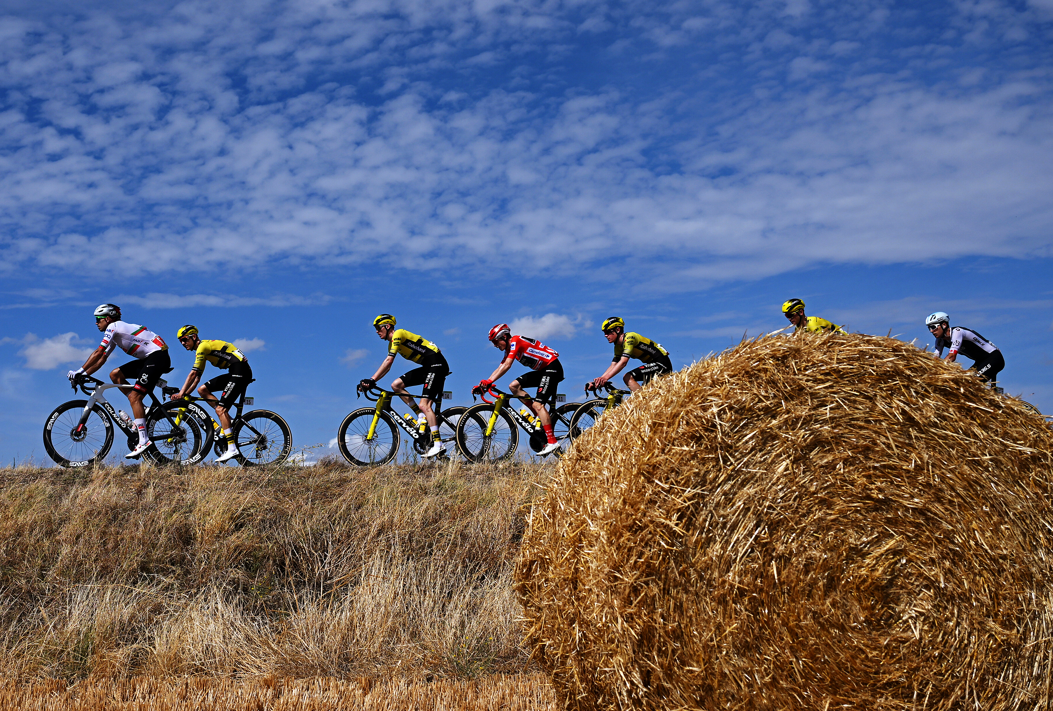 Jonas Vingegaard at the Vuelta a Espa&amp;ntilde;a riding behind a haybale