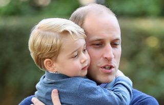 Prince George of Cambridge with Prince William, Duke of Cambridge at a children's party for Military families during the Royal Tour of Canada on September 29, 2016