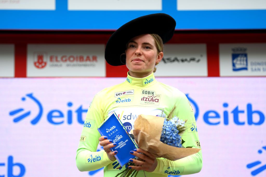 SAN SEBASTIAN SPAIN MAY 12 Demi Vollering of The Netherlands and Team SD Worx Protime celebrates at podium as Yellow Leader Jersey winner with the Txapela hat Trophy during the 3rd Itzulia Women 2024 Stage 3 a 1149km stage from San Sebastian to San Sebastian UCIWWT on May 12 2024 in San Sebastian Spain Photo by Alex BroadwayGetty Images