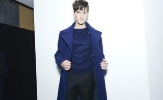 Male model wearing navy coat