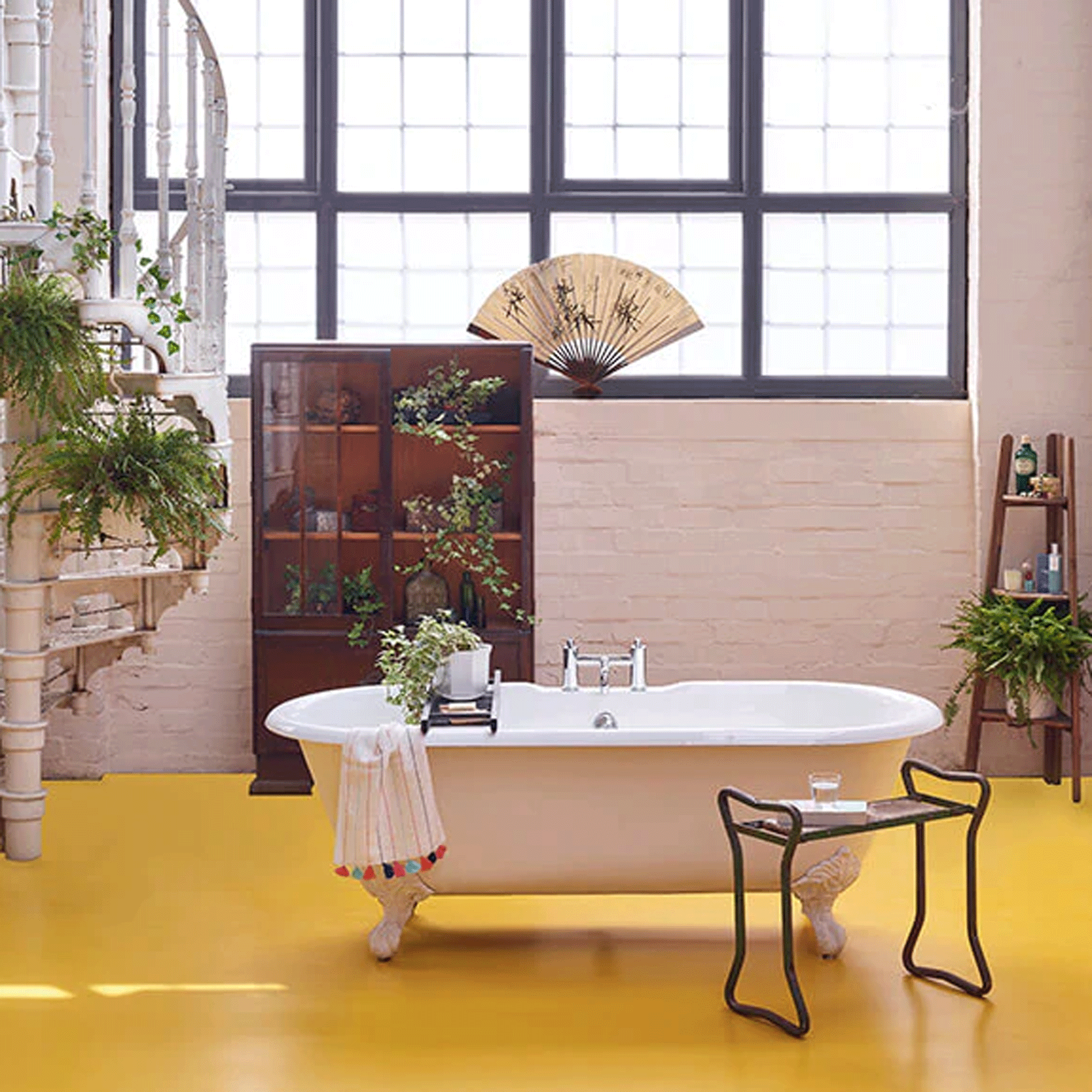 Freestanding bath with yellow vinyl flooring