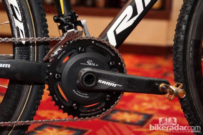 SRM SRAM S975 carbon cranks are fitted with thick Thorne aluminum chainrings.