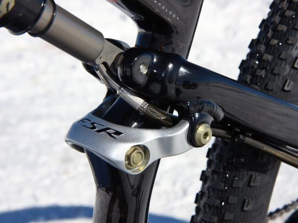 The tiny seat tube-mounted link helps keep the back end from wagging excessively though it's still not as stiff as we'd prefer.