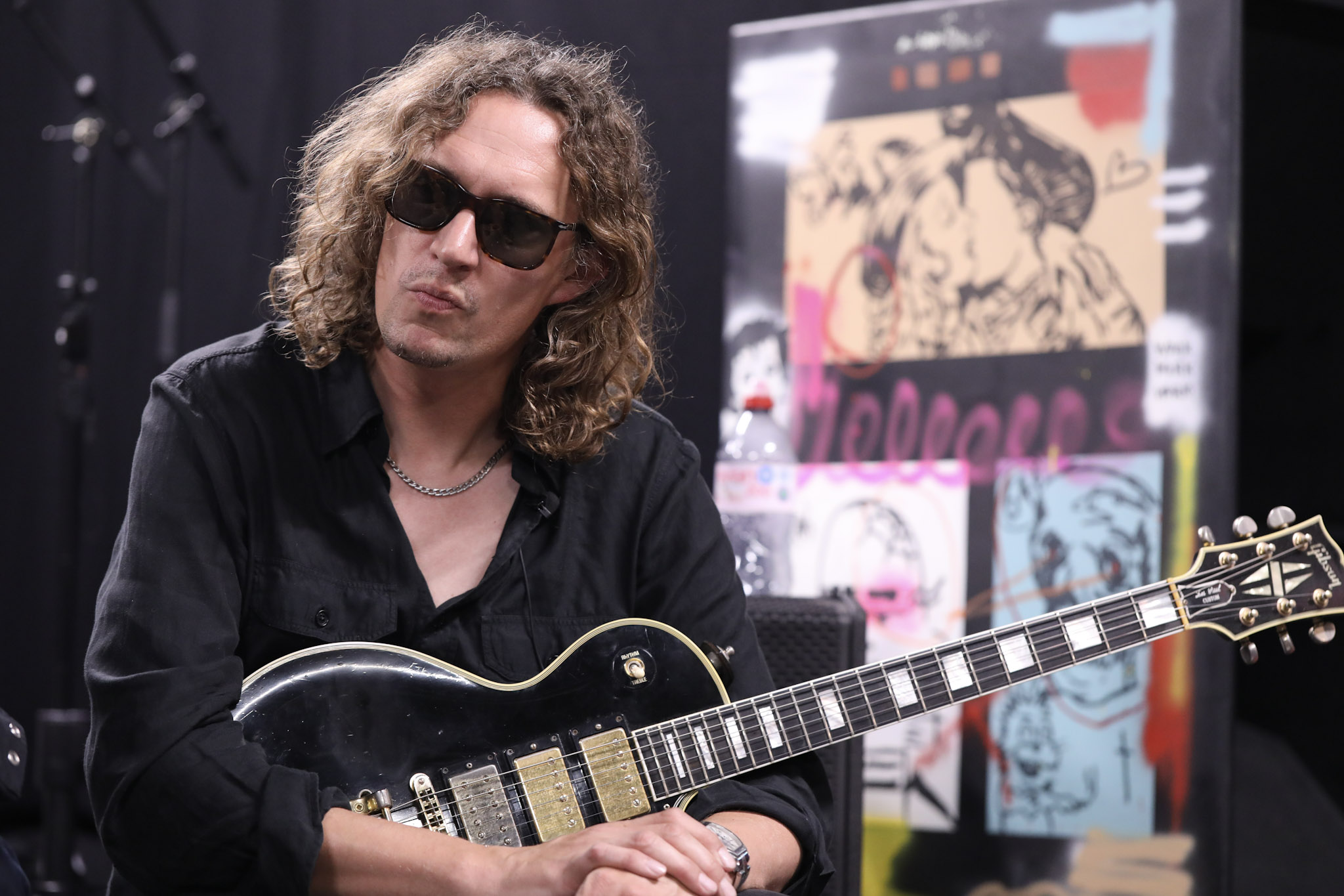 Dan Hawkins poses with a Gibson Les Paul Custom