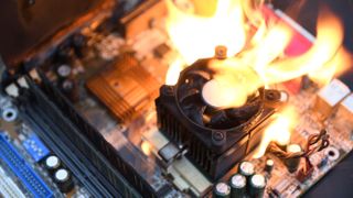A generic CPU air cooler mounted on a motherboard bursting into flames.