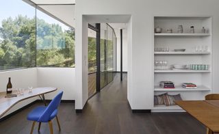 By splitting the house into separate wings with a central connecting courtyard, the bedrooms are peaceful resting areas, isolated from the living and kitchen space