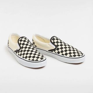 Black and white checkered Vans slip on trainers