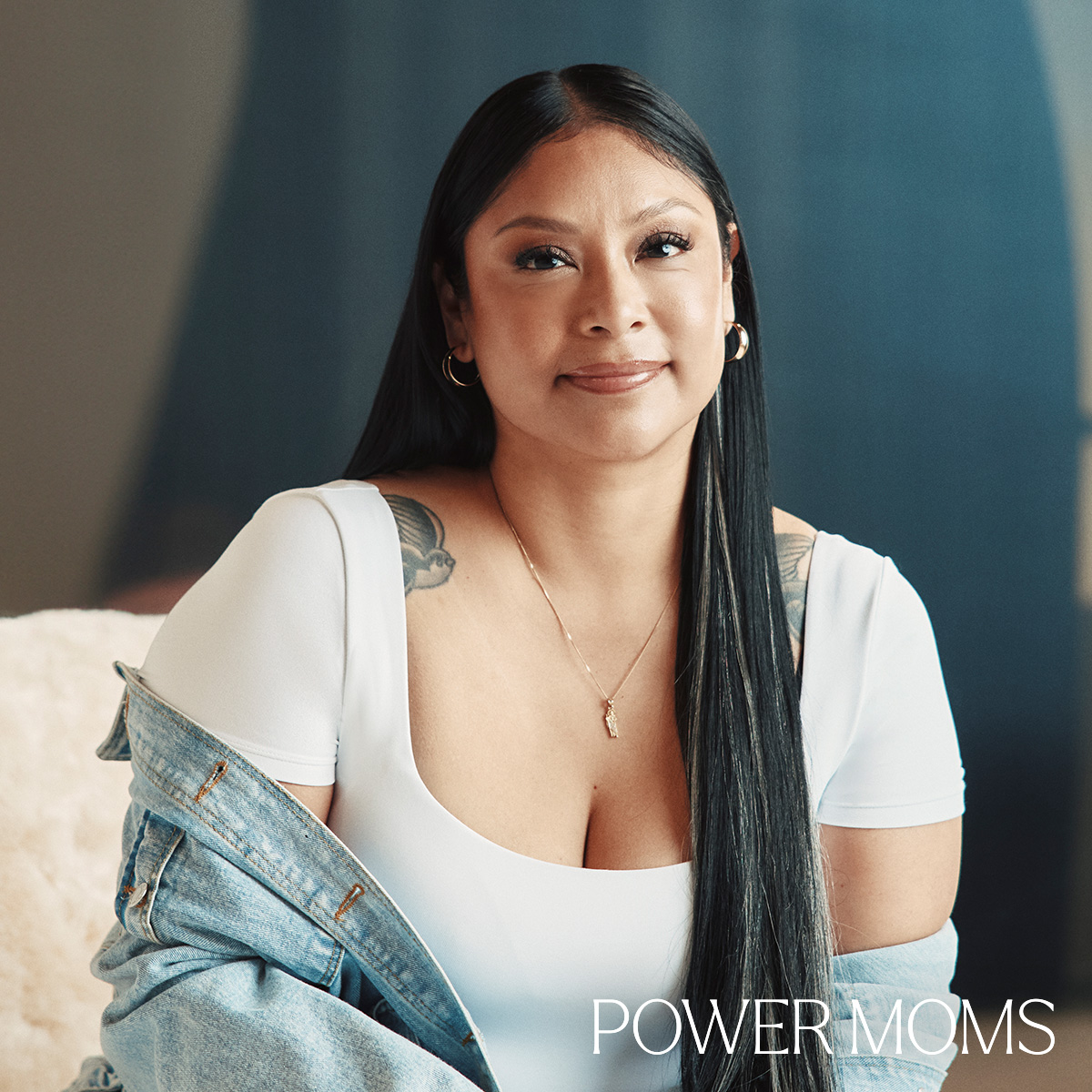 Angelica Vargas seated in a white top and denim jacket.