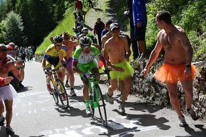 Francesco Bongiorno and Michael Rogers chased by ridiculous men on the climb
