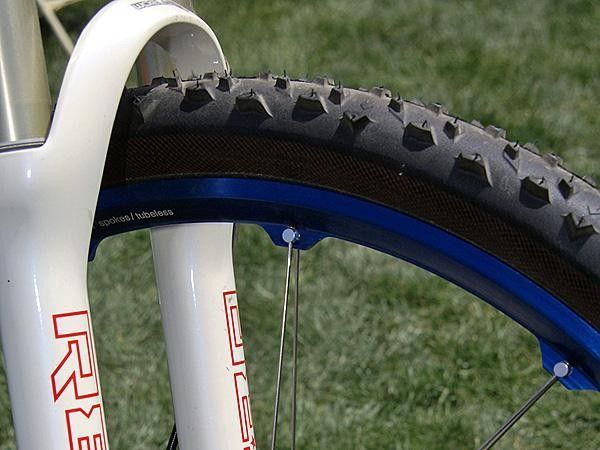 The unique 'Y'-shaped rim uses a unique method to attach the paired spokes, leaving the outer wall solid and airtight for easier tubeless tire compatibility.