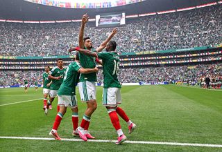 Raul Jimenez #9 of Mexico celebrates with teammates after scoring the team's second goal during the FIFA World Cup 2026 Group A match between Mexico and South Africa at Mexico City Stadium