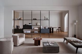 Contemporary Living Room with muted tones, open plan shelving, and modern seating