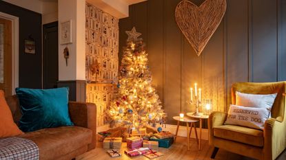 A brightly lit Christmas tree in a cosy living room